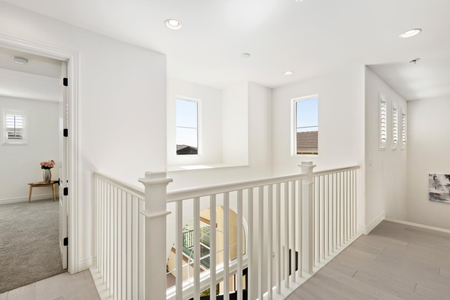 111 Dunfirth Drive Hayward, CA 94542 - Photo 42 of 49 a view of a hallway with wooden floor and windows