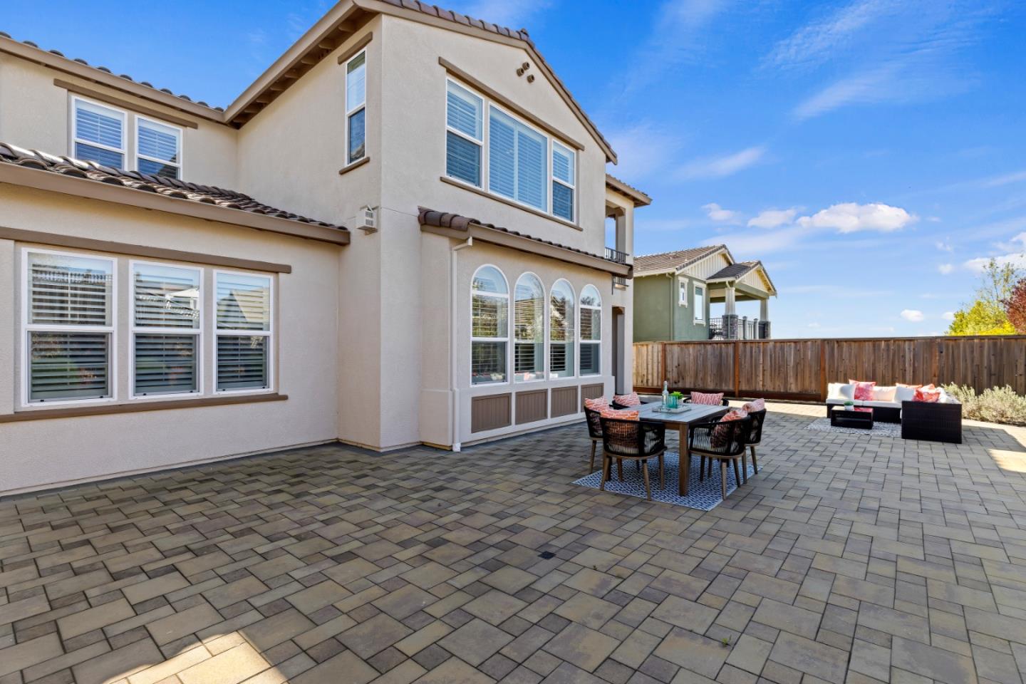 111 Dunfirth Drive Hayward, CA 94542 - Photo 47 of 49 a view of a patio with table and chairs and wooden fence