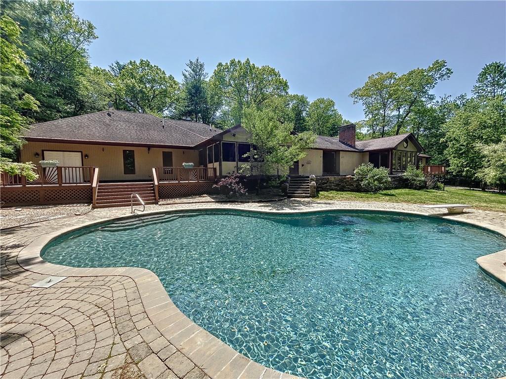 30 Pinnacle Mountain Road Simsbury, CT 06070 - Photo 1 of 1 a front view of a house with garden
