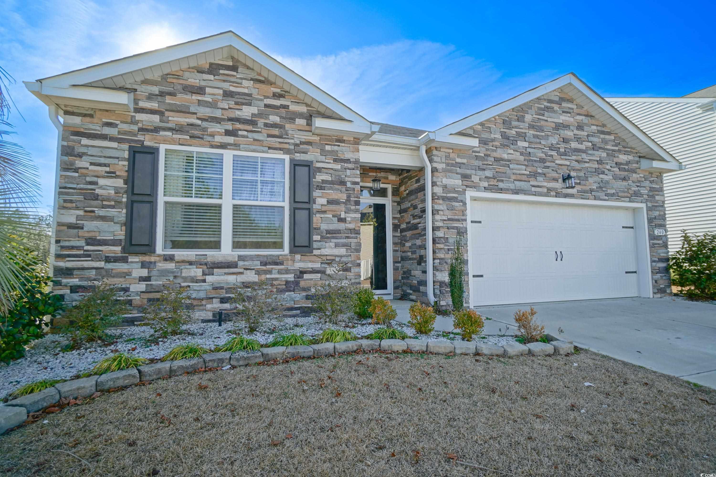 240 Pin Oak Drive Murrells Inlet, SC 29576 - Photo 1 of 40 View of front facade with a garage