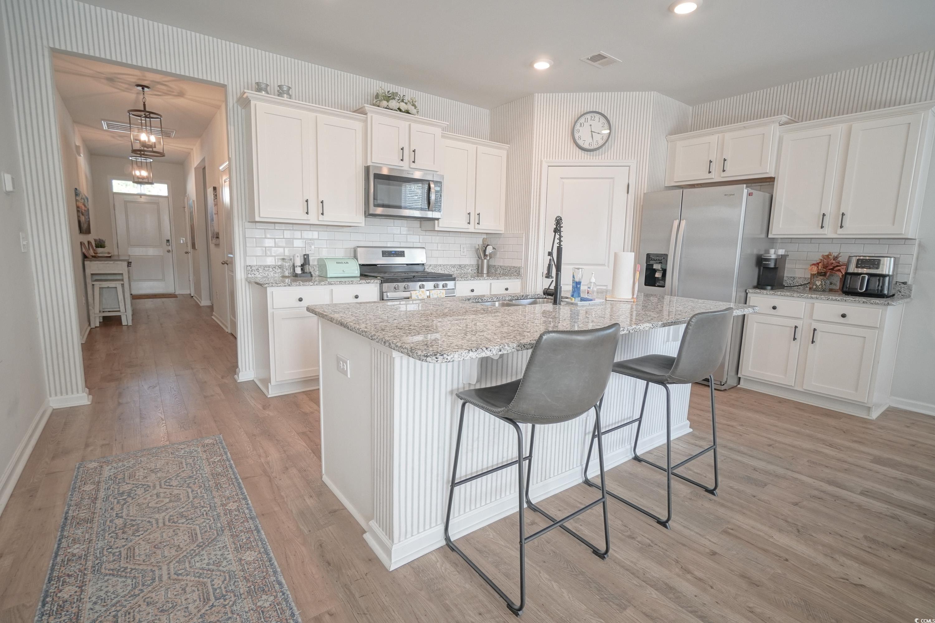 240 Pin Oak Drive Murrells Inlet, SC 29576 - Photo 11 of 40 Kitchen featuring sink, light hardwood / wood-styl