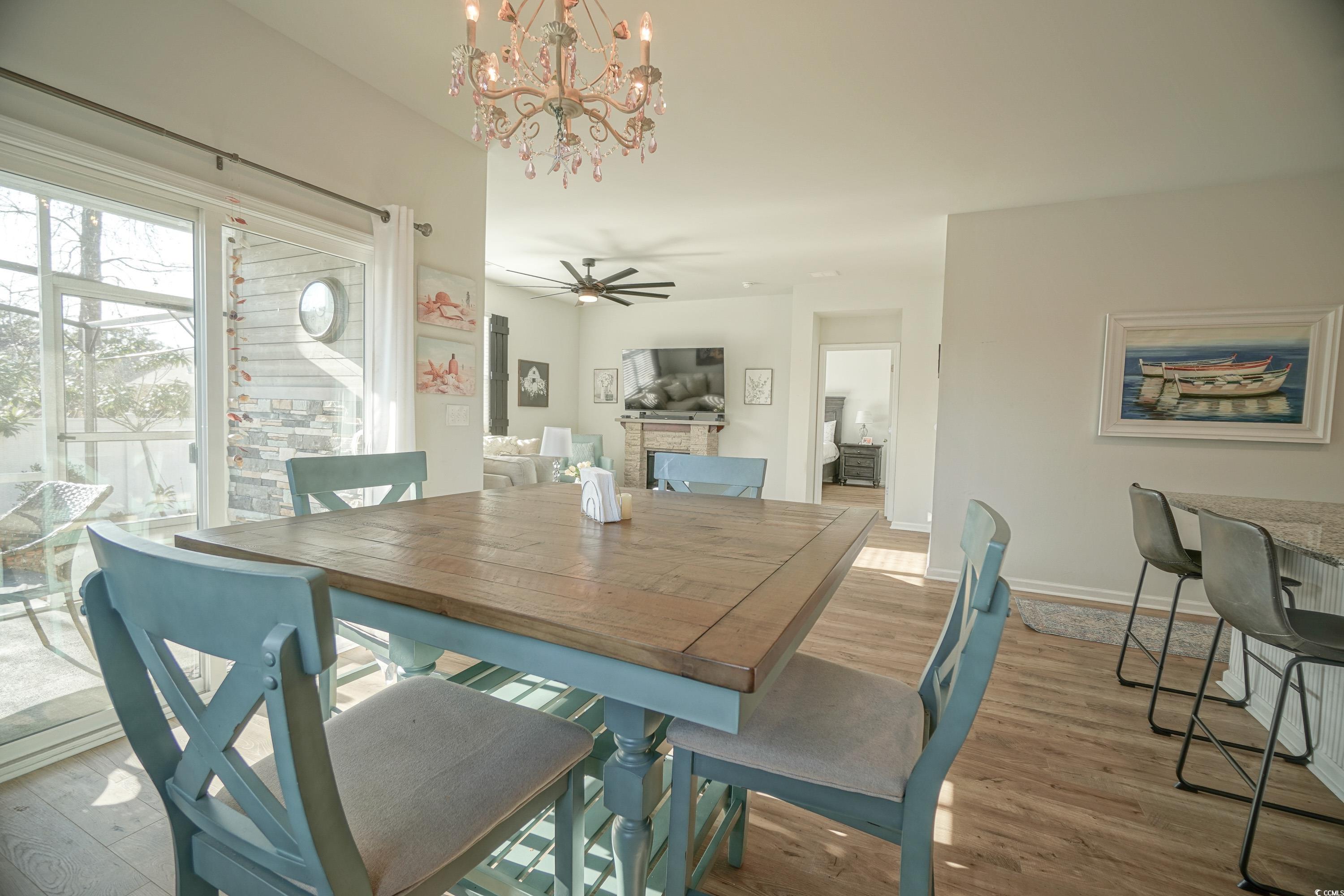 240 Pin Oak Drive Murrells Inlet, SC 29576 - Photo 14 of 40 Dining room with ceiling fan with notable chandeli