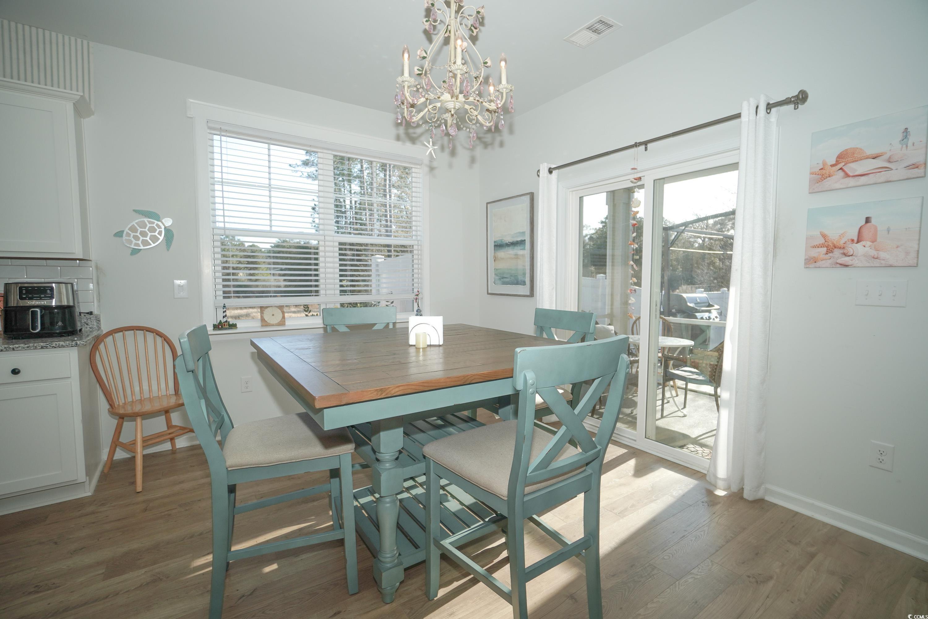 240 Pin Oak Drive Murrells Inlet, SC 29576 - Photo 15 of 40 Dining area with hardwood / wood-style flooring an