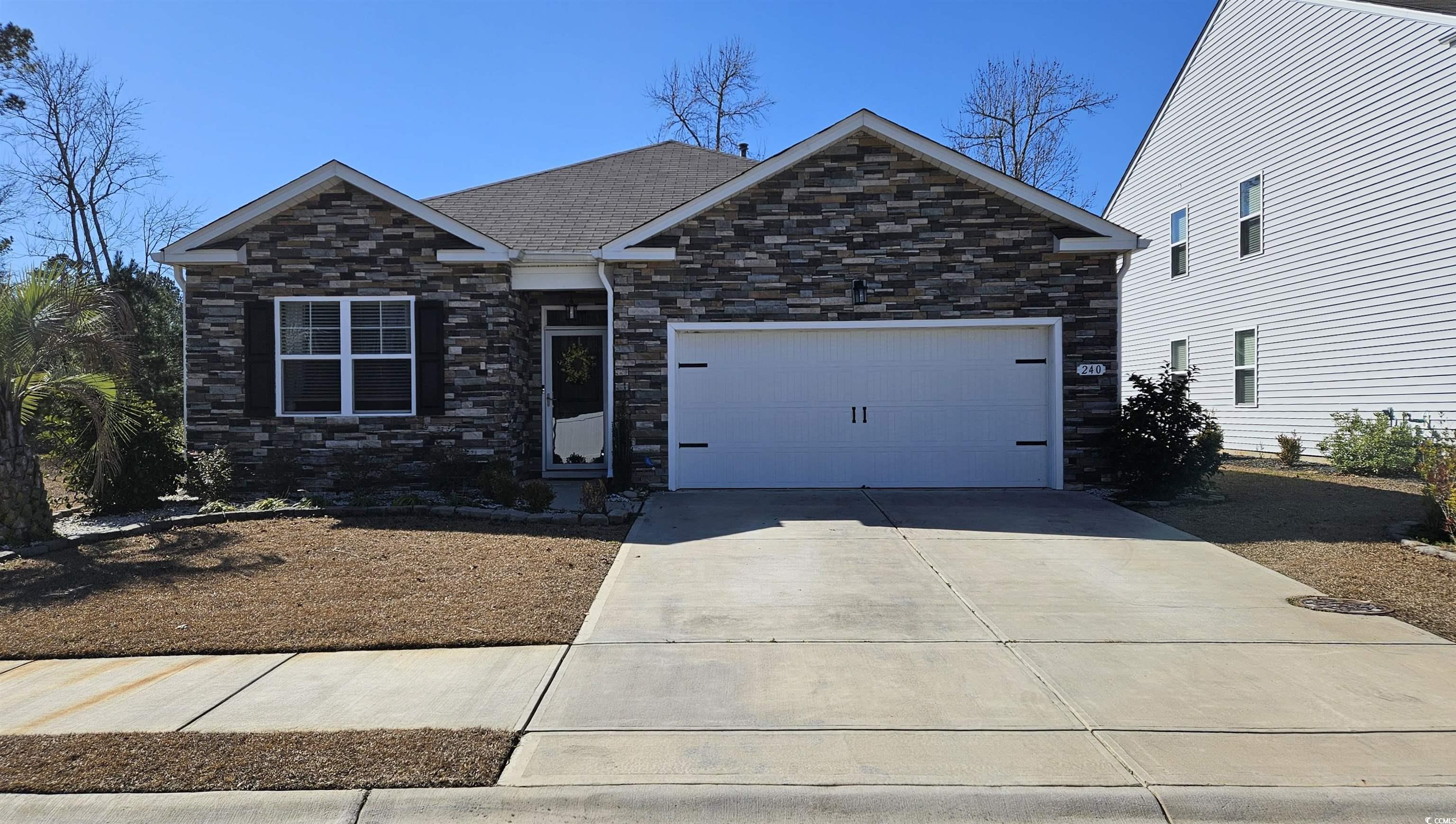 240 Pin Oak Drive Murrells Inlet, SC 29576 - Photo 2 of 40 View of front of home with a garage