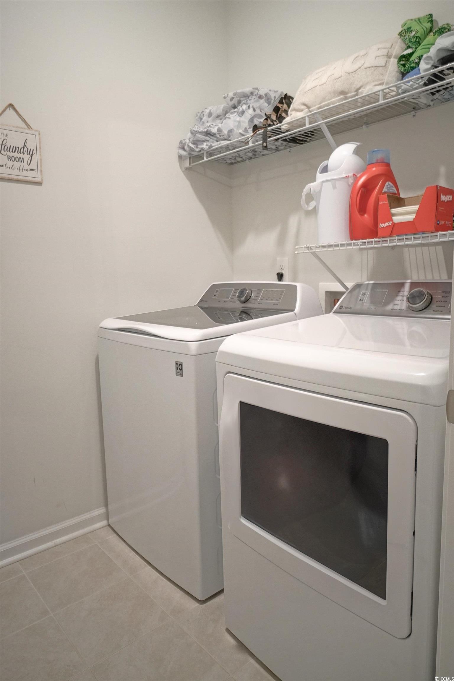 240 Pin Oak Drive Murrells Inlet, SC 29576 - Photo 29 of 40 Washroom with light tile patterned floors and wash