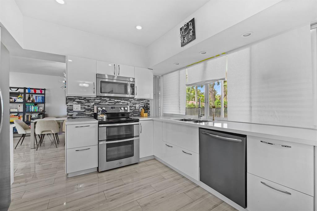 3500 North 46th Avenue Hollywood, FL 33021 - Photo 10 of 13 a kitchen with a stove and a sink