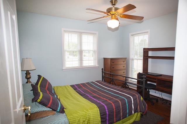 4086 Trinity Road Franklin, TN 37067 - Photo 12 of 20 a bedroom with a bed and a chandelier