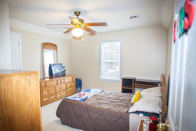 4086 Trinity Road Franklin, TN 37067 - Photo 15 of 20 a bedroom with a bed and a chandelier