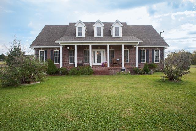 4086 Trinity Road Franklin, TN 37067 - Photo 20 of 20 a front view of a house with a garden and porch