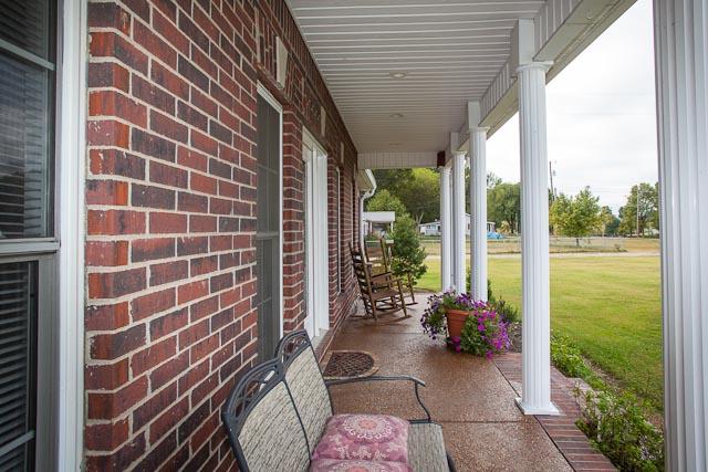 4086 Trinity Road Franklin, TN 37067 - Photo 2 of 20 a view of a balcony with chair and potted plants