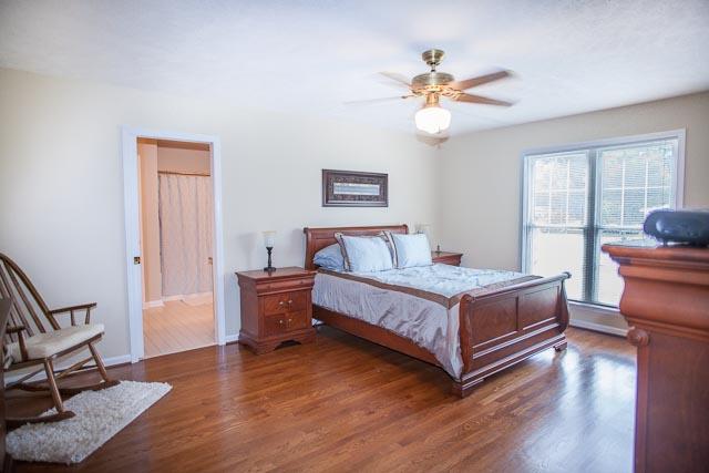 4086 Trinity Road Franklin, TN 37067 - Photo 10 of 20 a bedroom with a bed and wooden floor