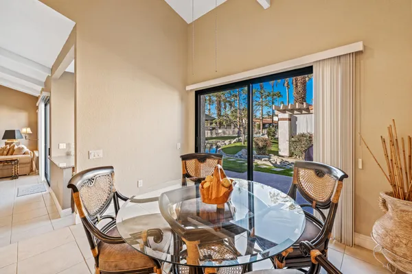 a very nice looking room with a large window and chandelier