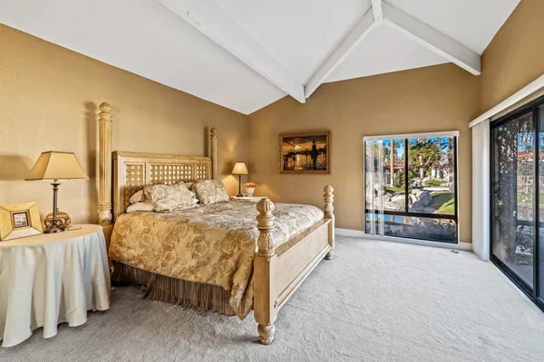 a bedroom with a bed and a cabinets