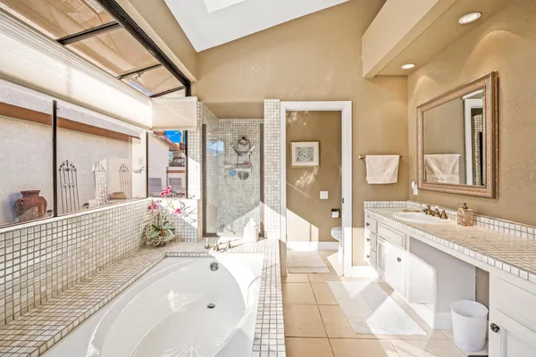 swimming pool view with a seating space