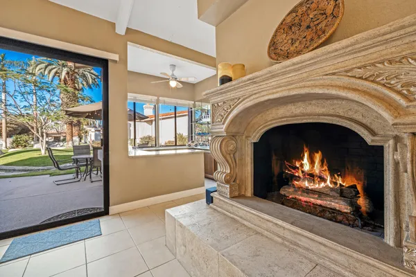 a very nice looking living room with a large window and furniture