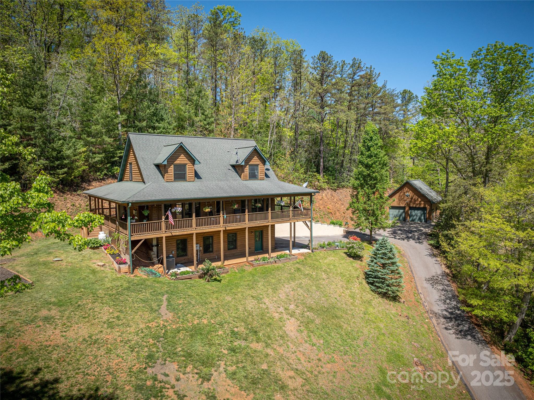 234 Deer Run Road Canton, NC 28716 - Photo 1 of 48 a view of a house with a yard and sitting area