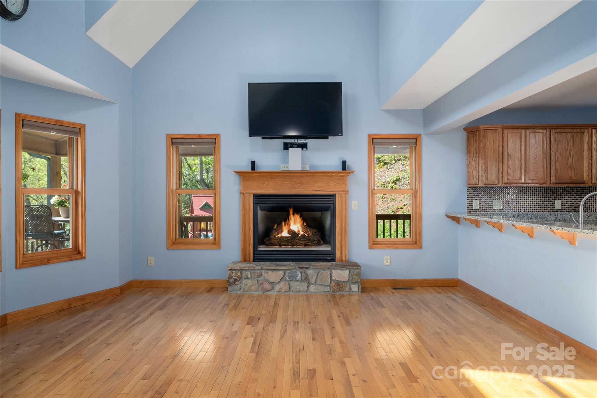 234 Deer Run Road Canton, NC 28716 - Photo 15 of 48 a view of an empty room with a fireplace and a window
