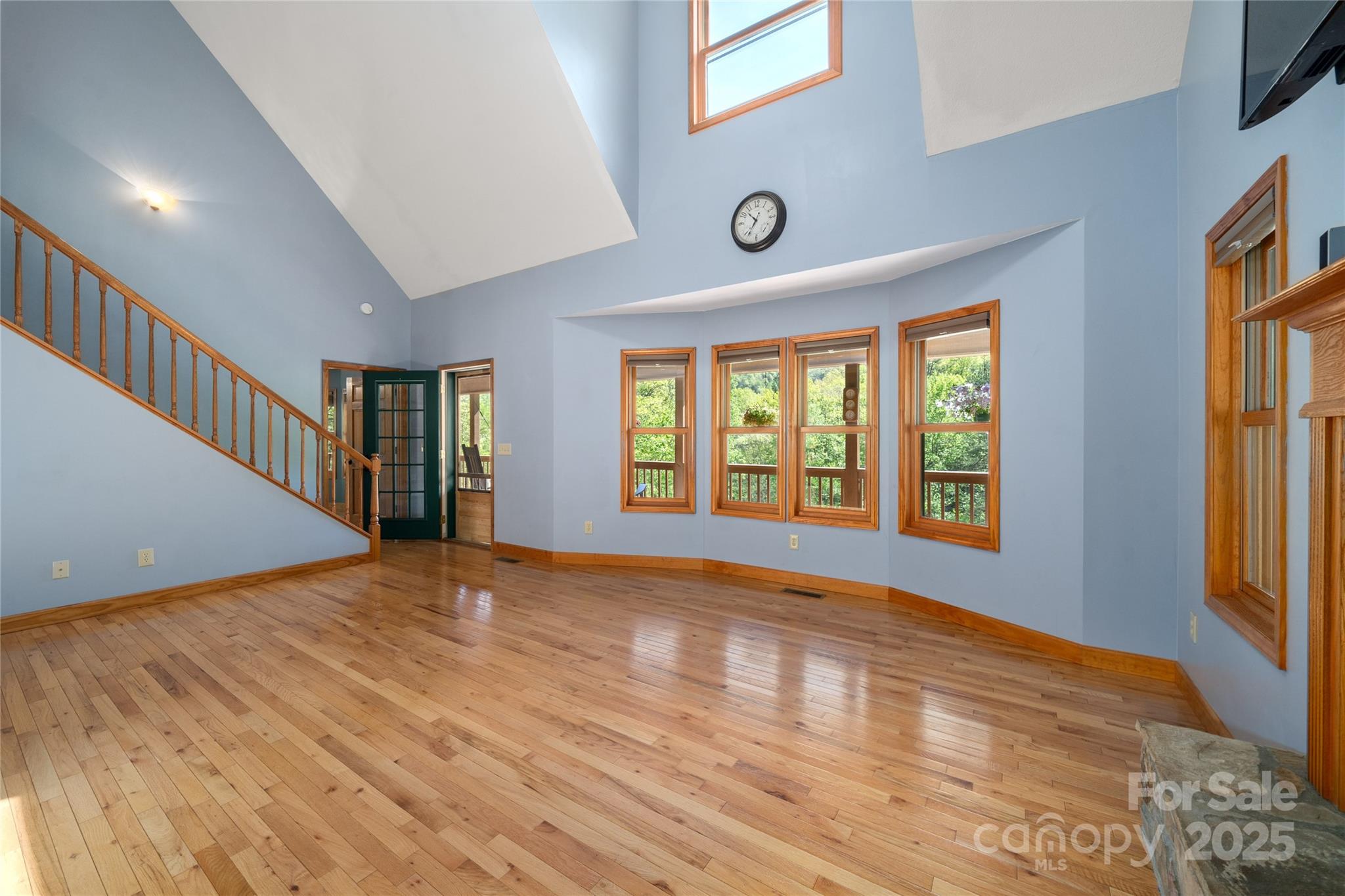 234 Deer Run Road Canton, NC 28716 - Photo 18 of 48 a view of an empty room with wooden floor and a window