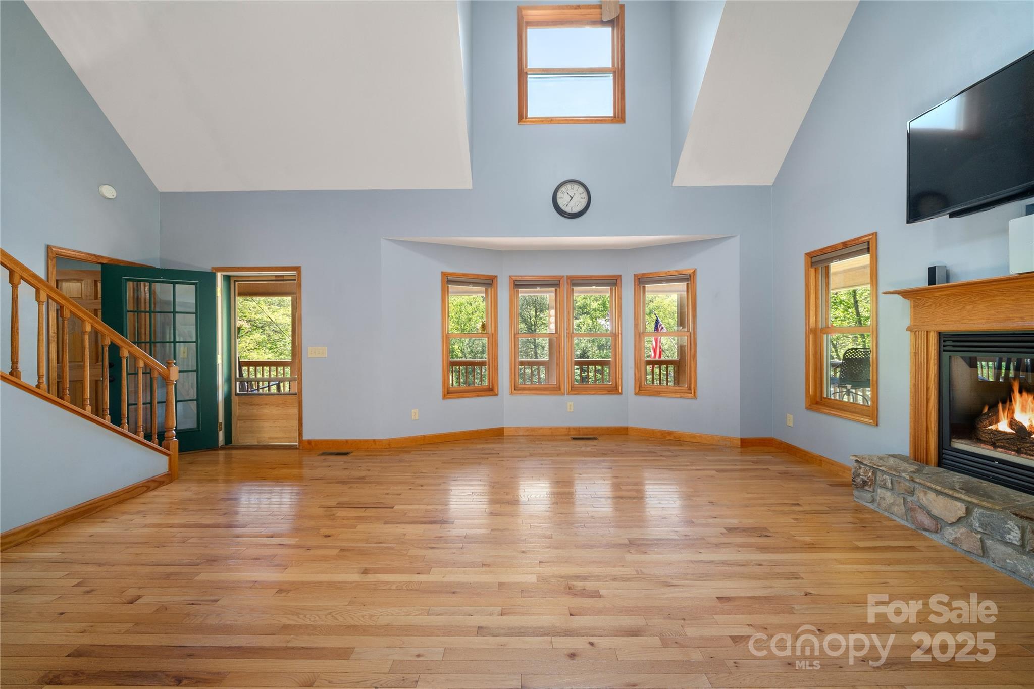 234 Deer Run Road Canton, NC 28716 - Photo 19 of 48 a view of an empty room with window and wooden floor