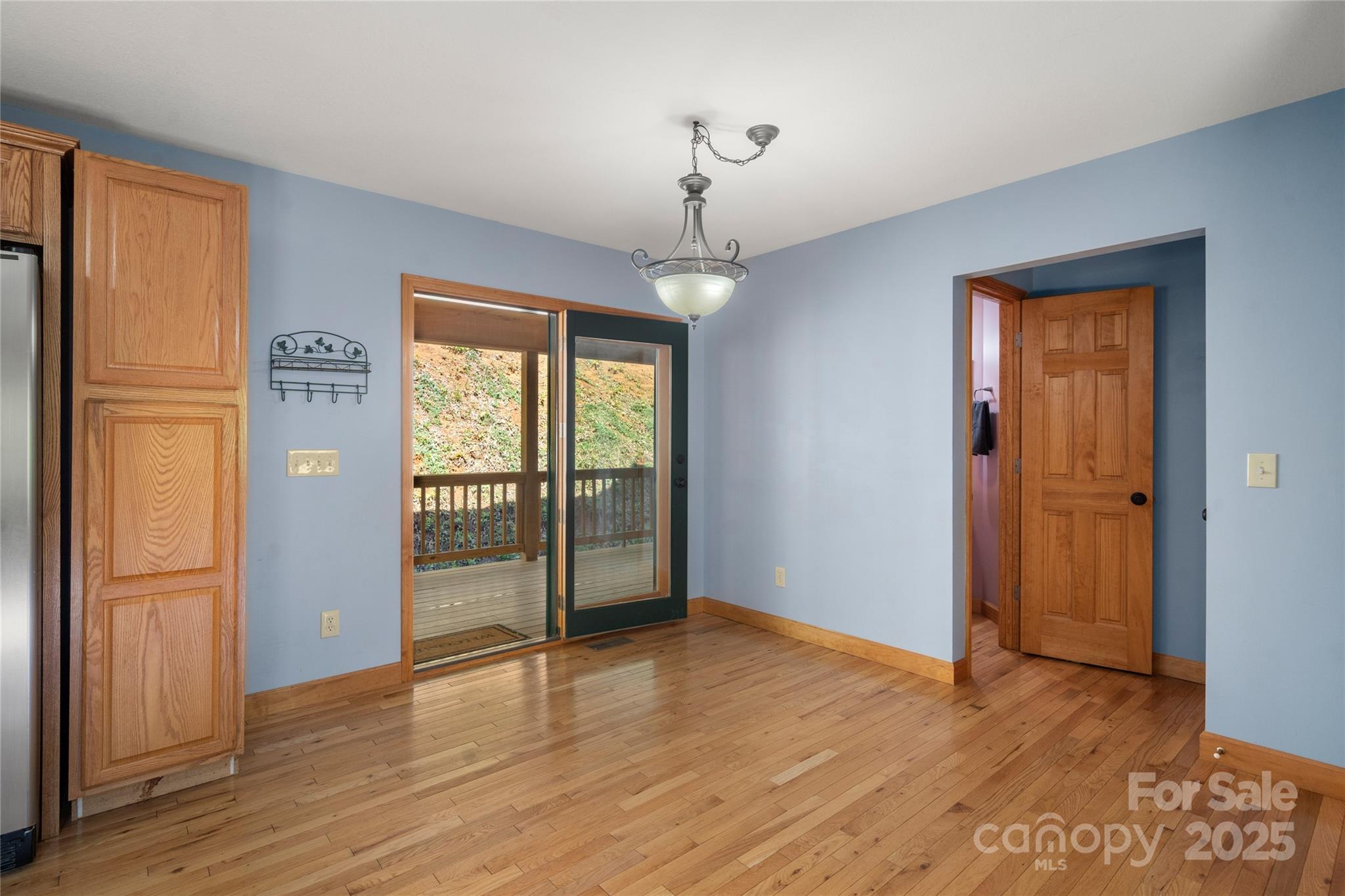 234 Deer Run Road Canton, NC 28716 - Photo 24 of 48 a view of an empty room with window and wooden floor