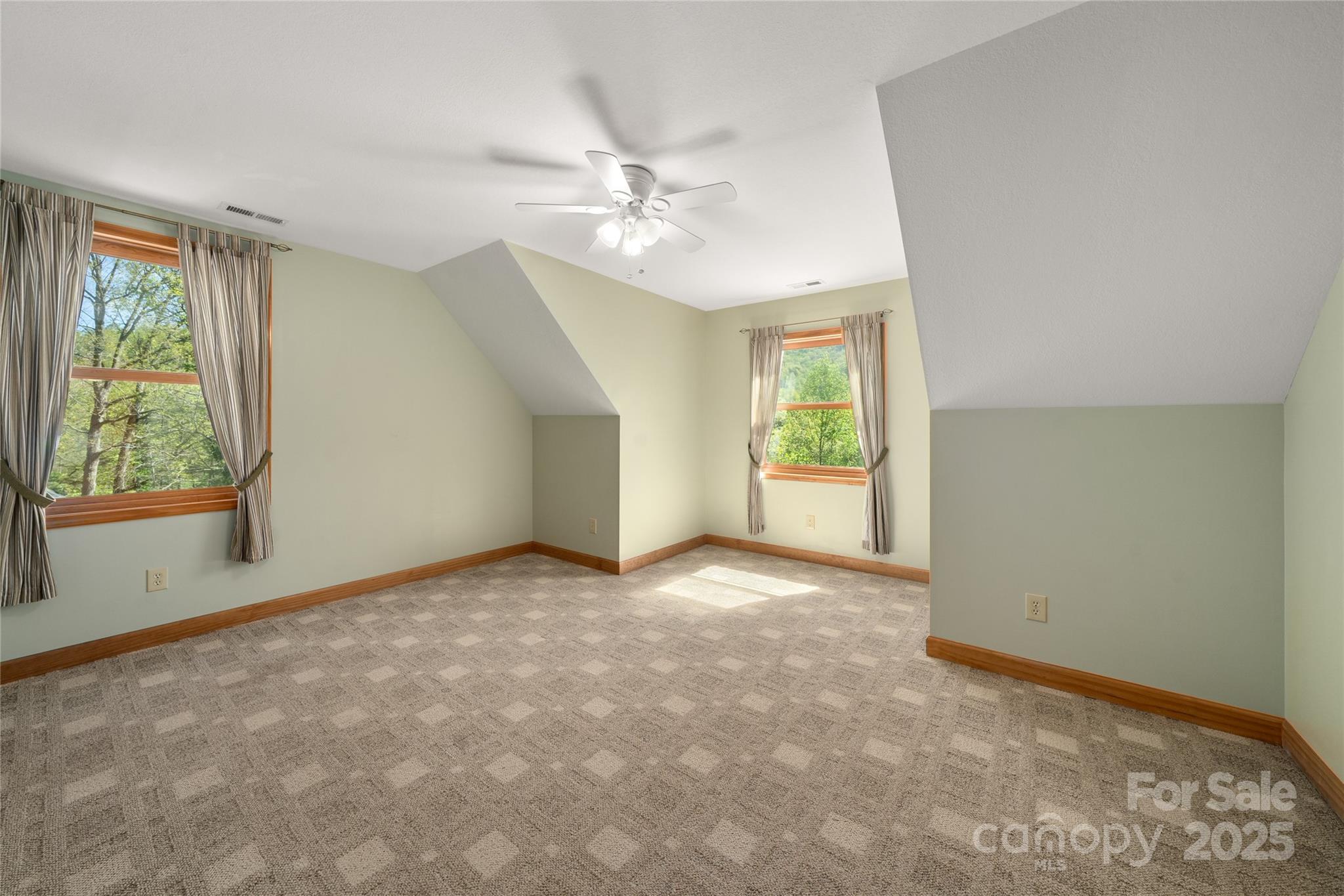 234 Deer Run Road Canton, NC 28716 - Photo 33 of 48 an empty room with windows and fan