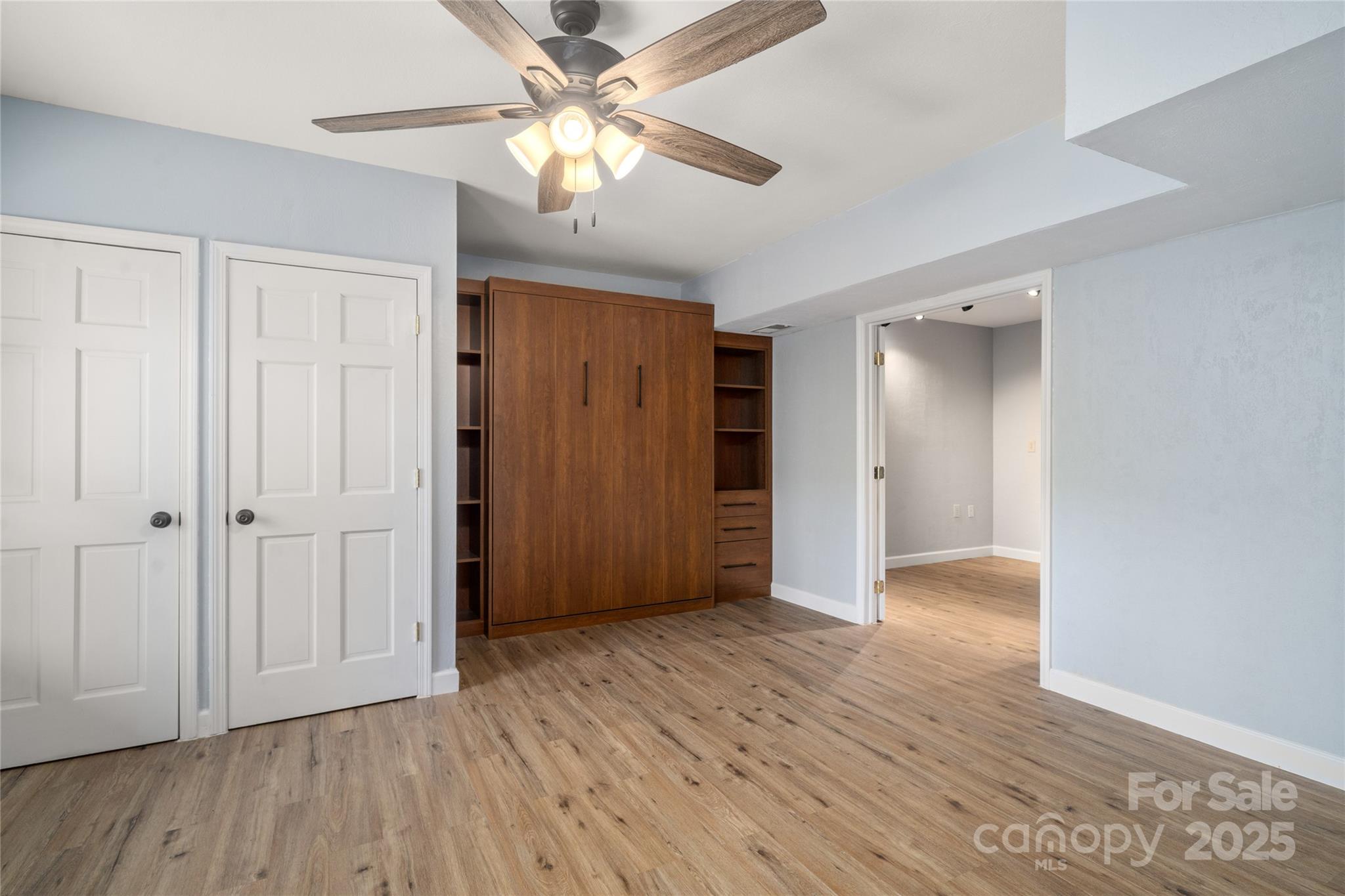 234 Deer Run Road Canton, NC 28716 - Photo 37 of 48 an empty room with wooden floor closet and windows
