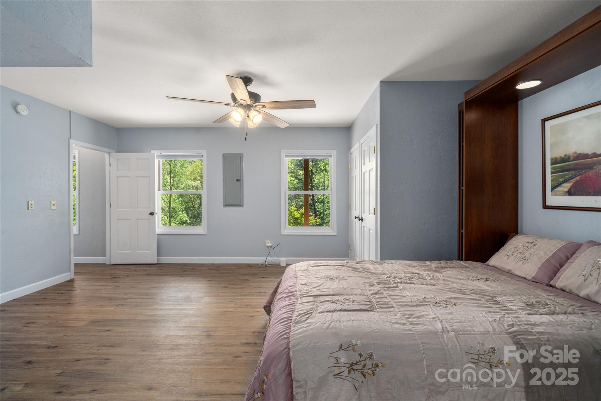 234 Deer Run Road Canton, NC 28716 - Photo 40 of 48 a spacious bedroom with a large bed and a window