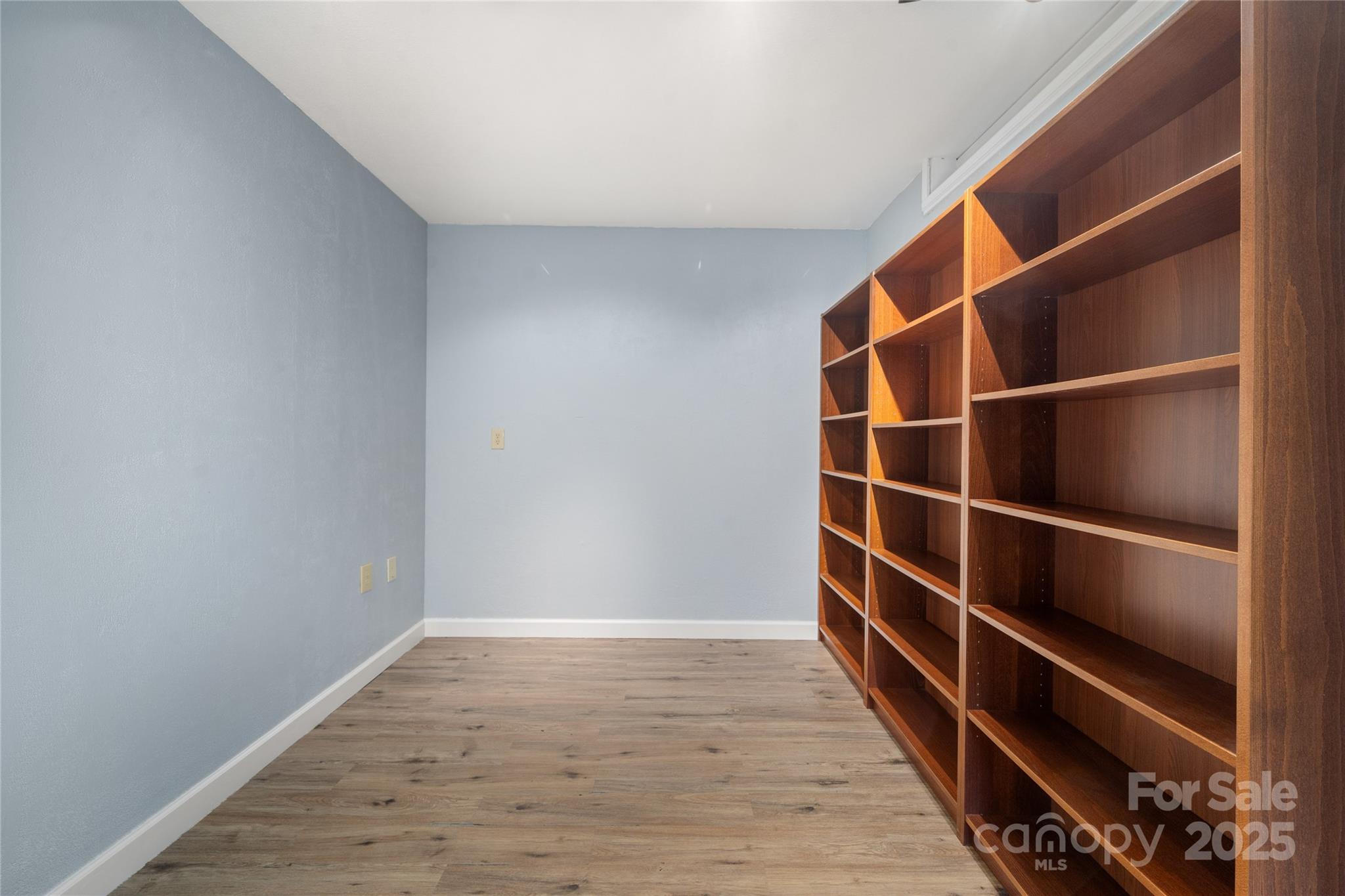 234 Deer Run Road Canton, NC 28716 - Photo 41 of 48 a view of walk in closet with empty racks
