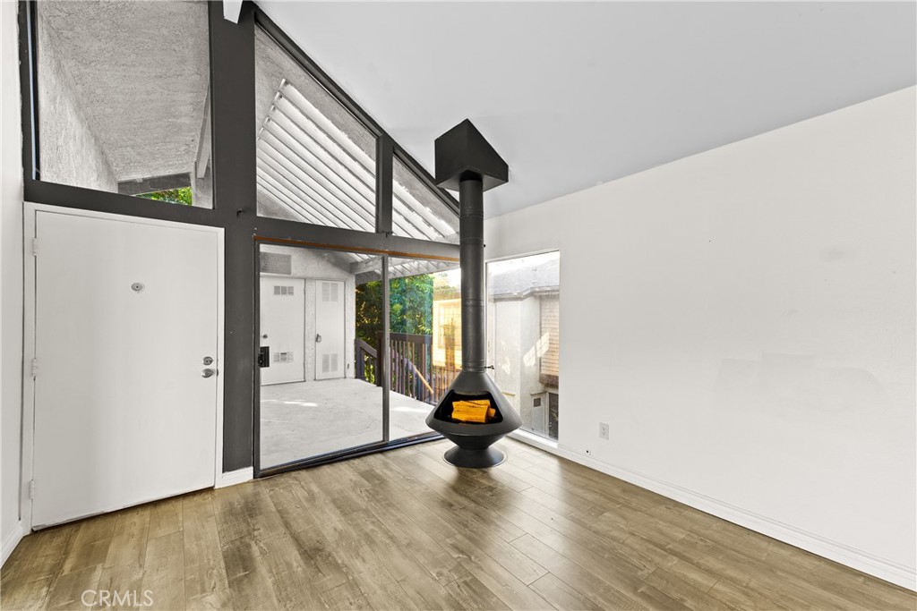 4140 Workman Mill Road, Unit 191 Whittier, CA 90601 - Photo 3 of 21 a view of empty room with wooden floor and fan