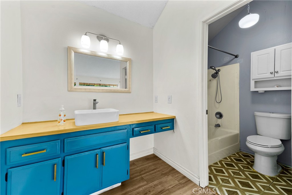 4140 Workman Mill Road, Unit 191 Whittier, CA 90601 - Photo 10 of 21 a bathroom with a sink a toilet and shower