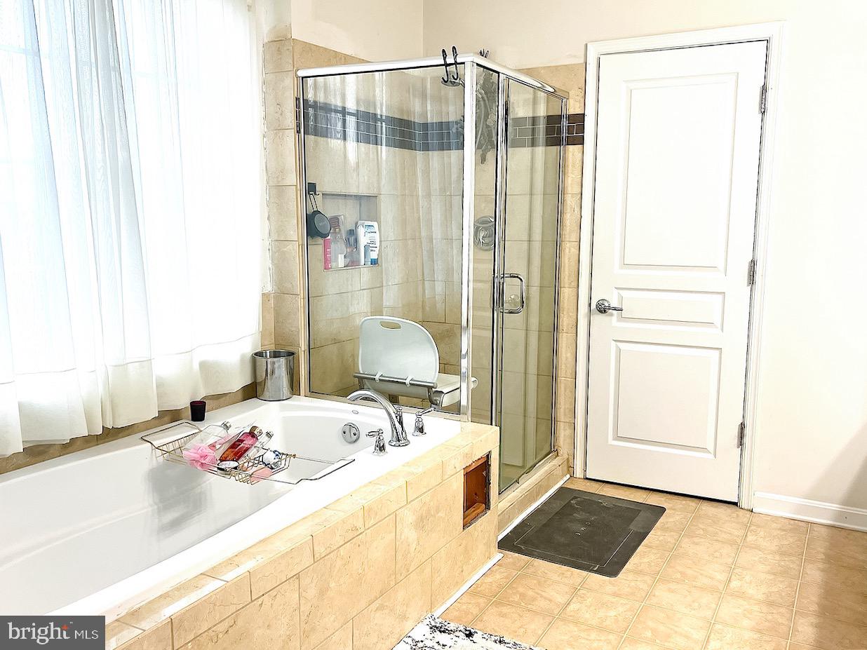 1649 Thorndale Road Breinigsville, PA 18031 - Photo 11 of 19 a bathroom with a bathtub and a shower