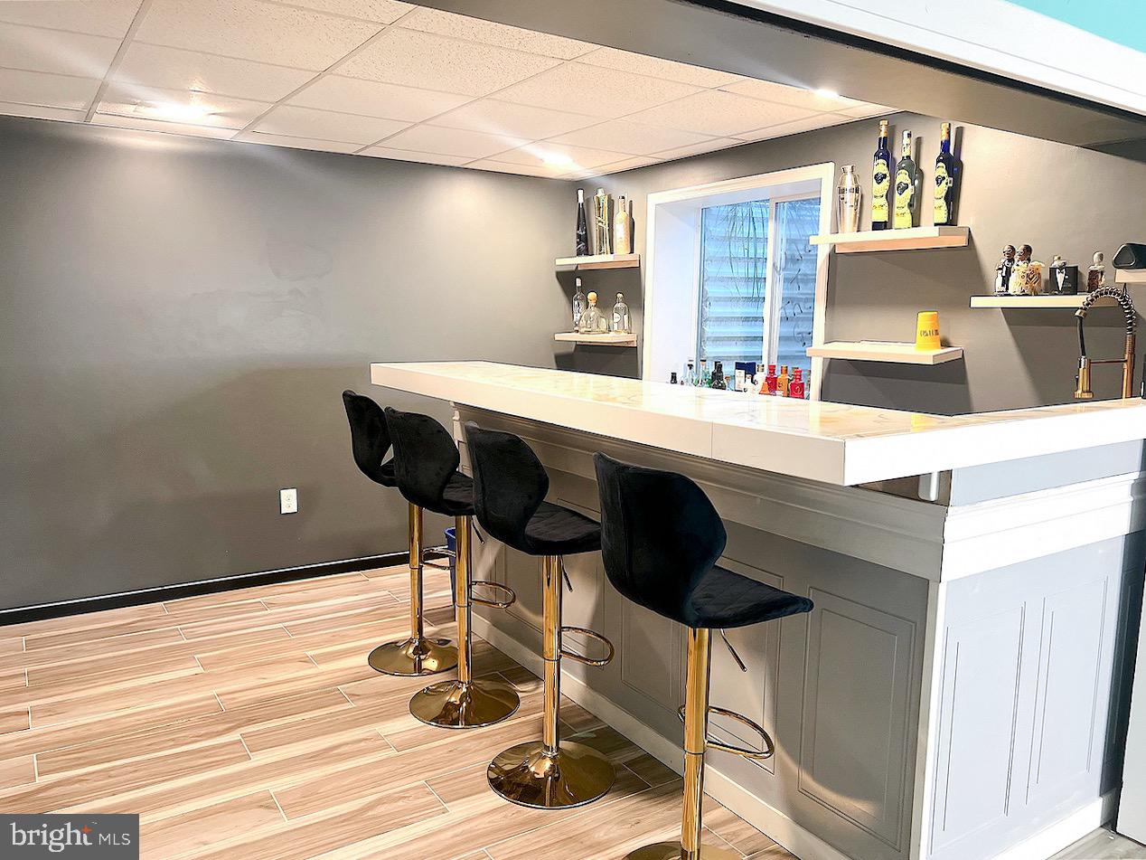 1649 Thorndale Road Breinigsville, PA 18031 - Photo 16 of 19 a room with table chairs and wooden floor