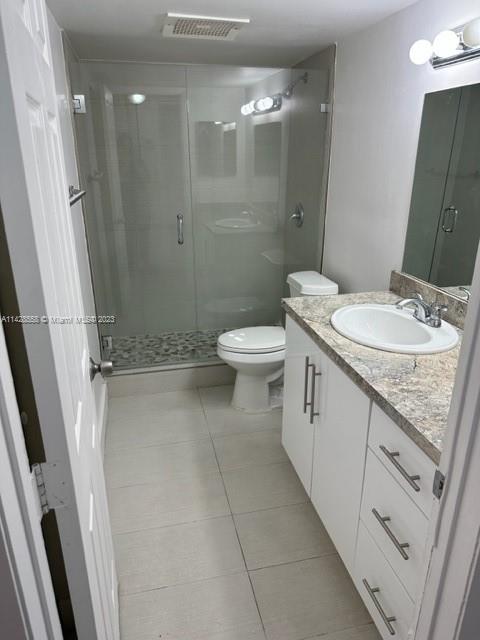 Miami Lakes Miami Lakes, FL 33014 - Photo 5 of 8 a bathroom with a granite countertop sink toilet and shower