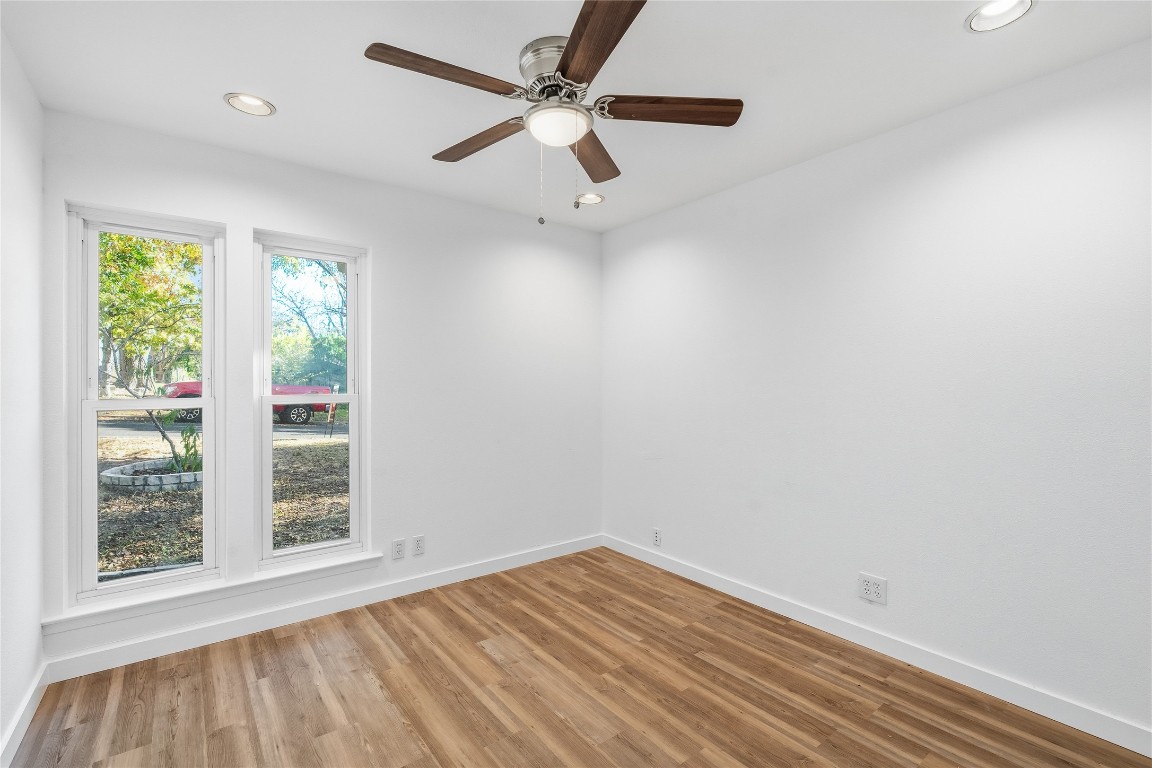6710 Kings Point West Austin, TX 78723 - Photo 20 of 40 wooden floor in an empty room with a window