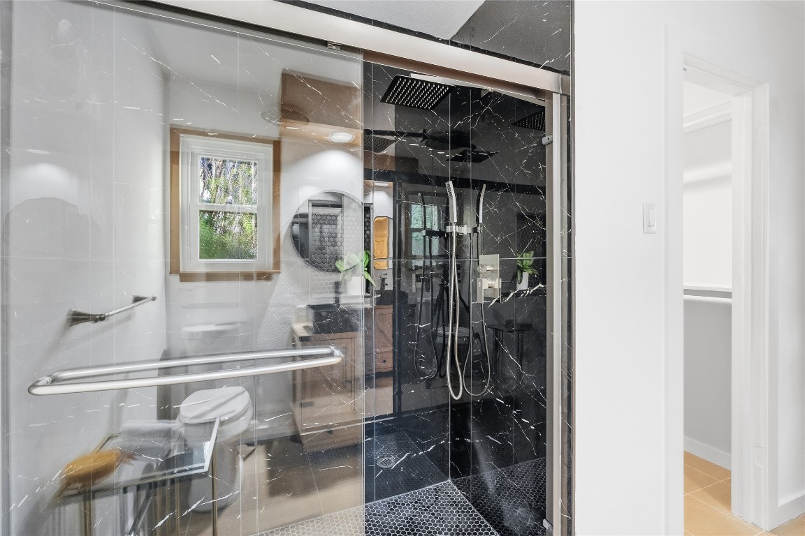 6710 Kings Point West Austin, TX 78723 - Photo 29 of 40 a bathroom with a sink and a mirror