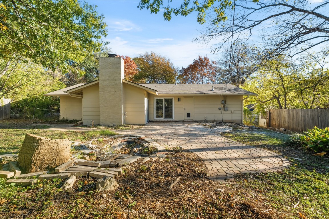 6710 Kings Point West Austin, TX 78723 - Photo 33 of 40 a view of a house with a yard