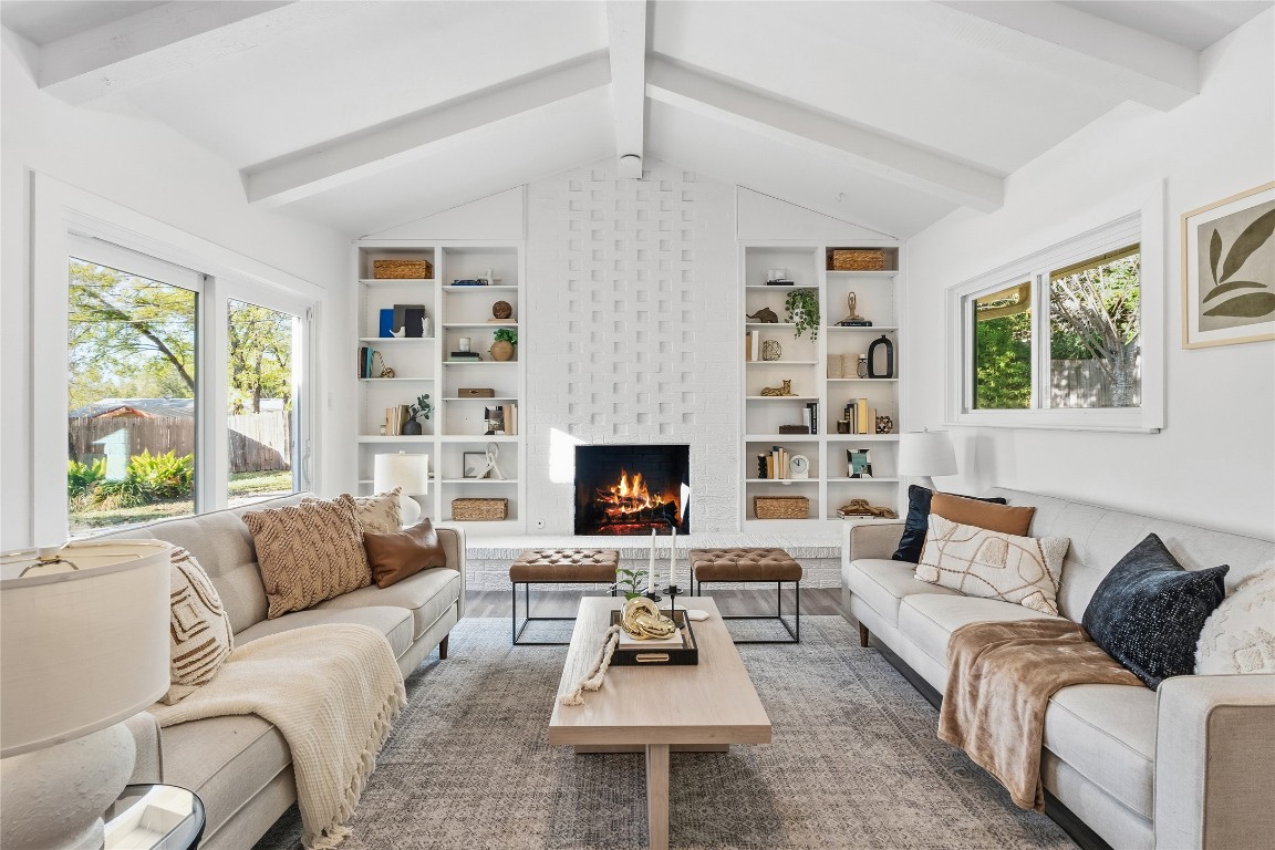 6710 Kings Point West Austin, TX 78723 - Photo 9 of 40 a living room with furniture and a fireplace