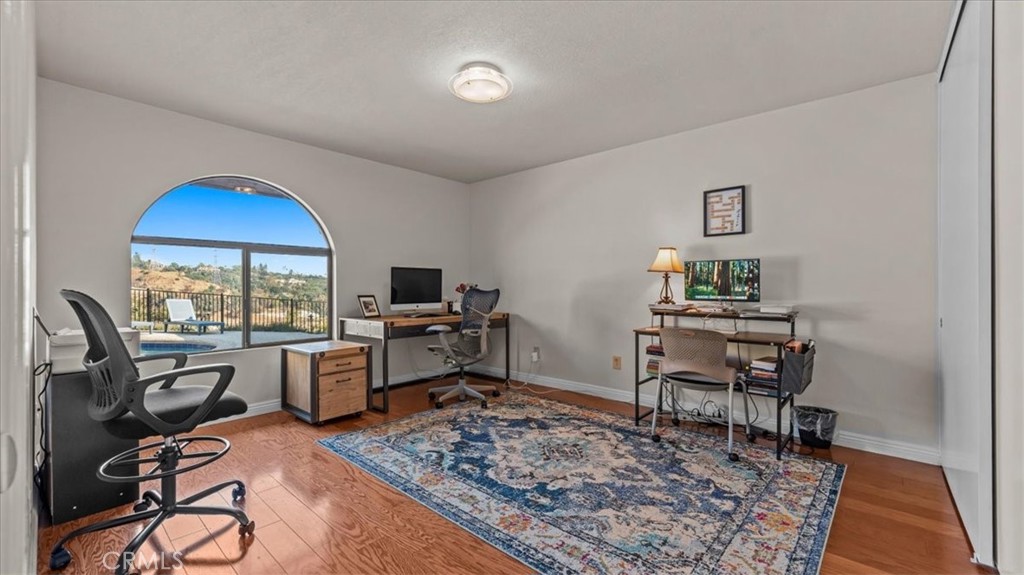 1958 Canyon Close Road Pasadena, CA 91107 - Photo 13 of 40 a view of a workspace with furniture and a rug