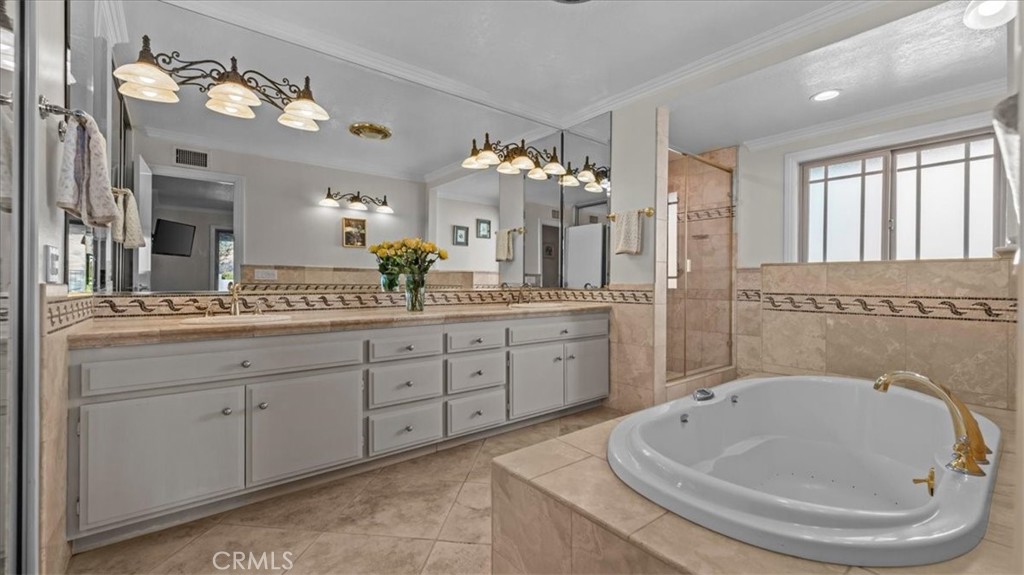 1958 Canyon Close Road Pasadena, CA 91107 - Photo 17 of 40 a spacious bathroom with a granite countertop sink a large mirror and a bathtub
