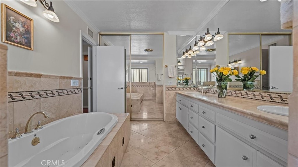 1958 Canyon Close Road Pasadena, CA 91107 - Photo 19 of 40 a bathroom with a tub sink and mirror
