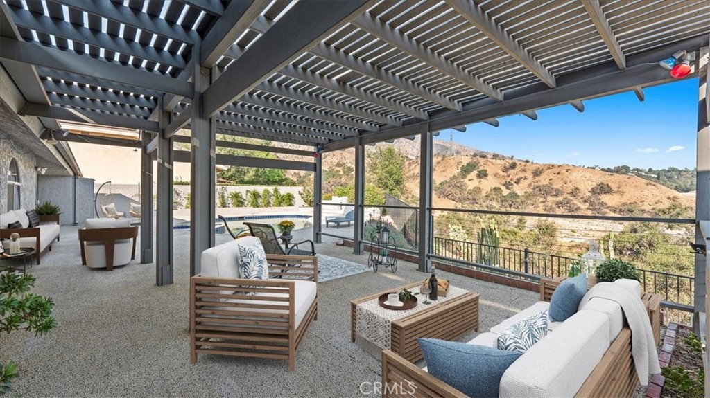 1958 Canyon Close Road Pasadena, CA 91107 - Photo 25 of 40 a room with furniture and a large window