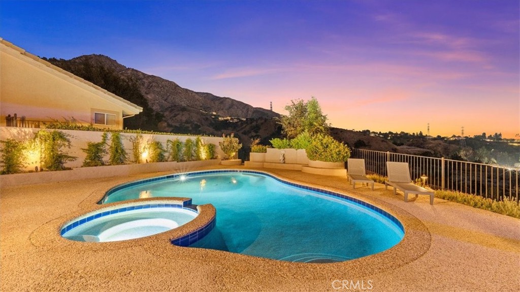 1958 Canyon Close Road Pasadena, CA 91107 - Photo 32 of 40 a view of a swimming pool with a table and chairs