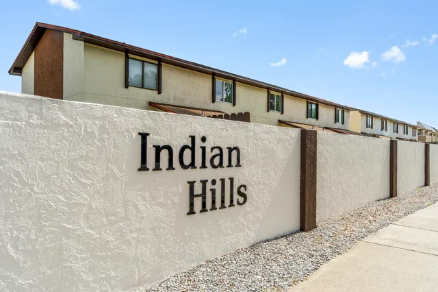 a view of a patio with table and chairs and couches