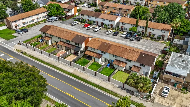 an aerial view of residential houses with outdoor space