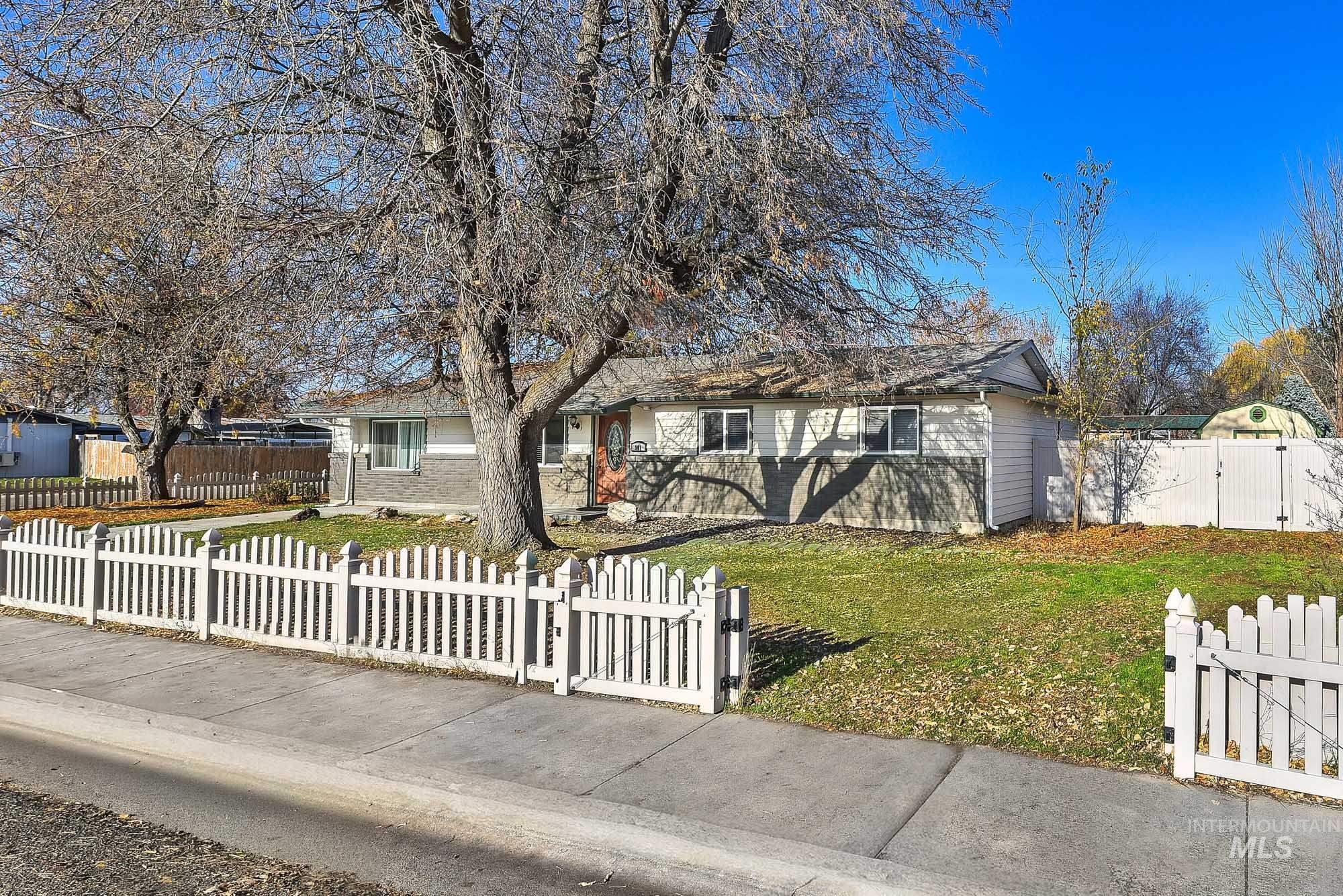 901 East 2nd Street South Middleton, ID 83644 - Photo 2 of 50 Single story home featuring a gate, a fenced front yard, and brick siding