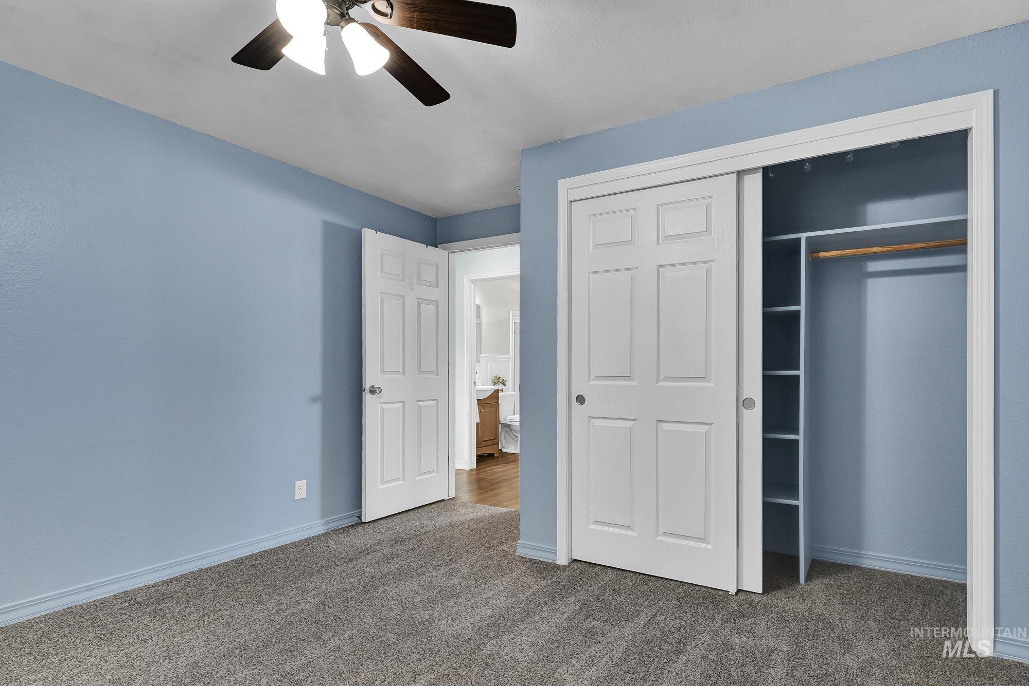 901 East 2nd Street South Middleton, ID 83644 - Photo 22 of 50 Unfurnished bedroom featuring a closet, new carpeted floors, and ceiling fan