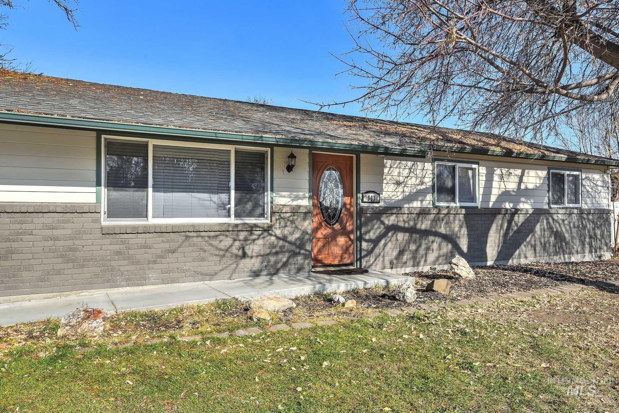 901 East 2nd Street South Middleton, ID 83644 - Photo 4 of 50 View of front walkway featuring brick siding, a front yard, and roof covering the front walk