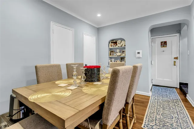 a dining room with a table and chairs
