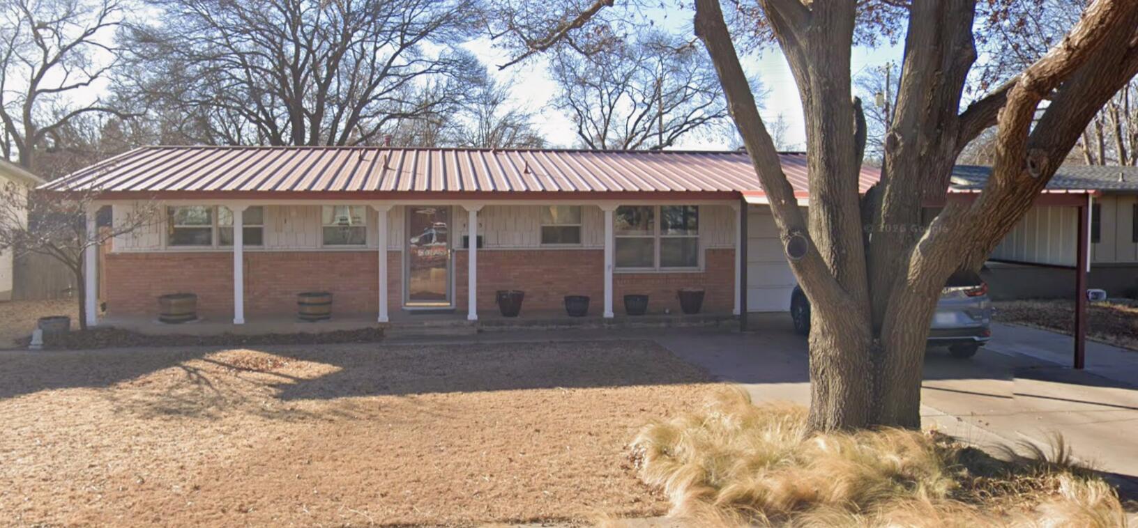 4013 38th Street Lubbock, TX 79413 - Photo 1 of 1 a view of a house with a large tree
