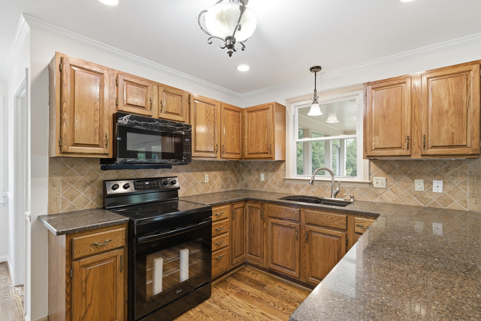 213 Rising Sun Lane Old Hickory, TN 37138 - Photo 13 of 37 a kitchen with stainless steel appliances granite countertop a sink a stove and cabinets